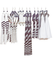Elegant and trendy clothes for women hanging.