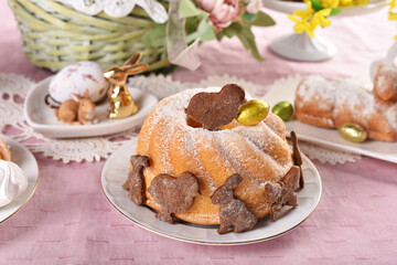 traditional Easter ring cake with cocoa cookies in bunny and chicken shape