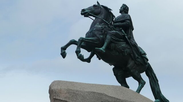 Emperor Peter the Great Bronze Horseman on a granite pedestal, background flying clouds landmark of St. Petersburg,  time lapse