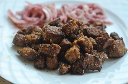 Pan fried beef liver with seasoned onion salad
