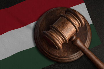 Judge gavel and flag of Hungary. Law and justice in Hungary. Violation of rights and freedoms