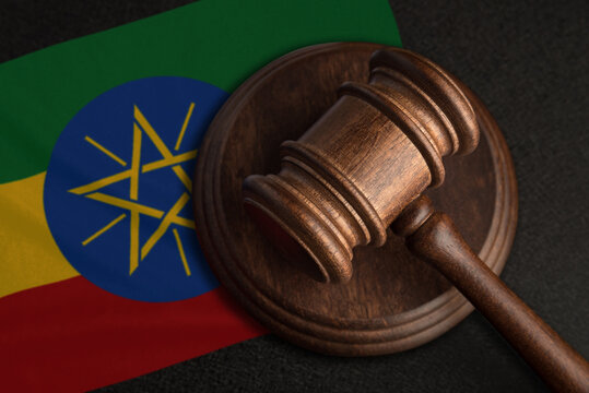 Judge gavel and flag of Ethiopia. Law and justice in Ethiopia. Violation of rights and freedoms
