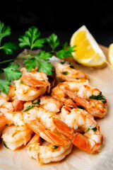  Fried shrimps with lemon close up, vertical photo soft focus