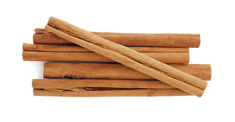 Aromatic dry cinnamon sticks on white background, top view