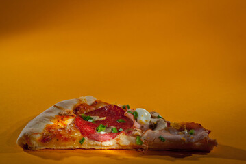 Pizza on orange background close up. Copy space and free space for text near food.