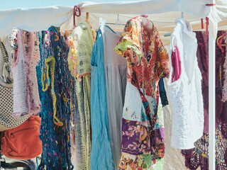 Colorful clothes and vintage accessories, in the open air Hippies markets of the island of Ibiza, Balearic Islands, Spain