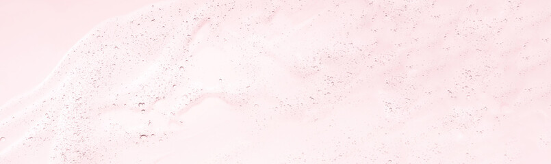 Gel serum face cleanser lotion textured pastel pink background. Web banner