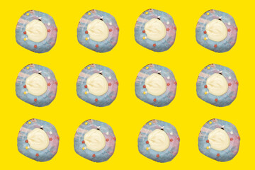Top view  of donuts on yellow background