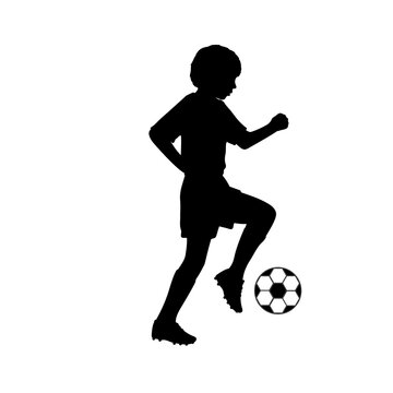 Silhouette young footballer playing football