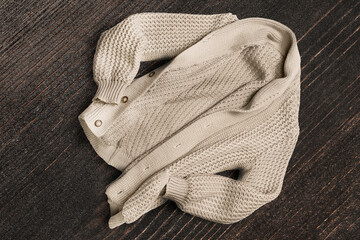 Cardigan on wooden background