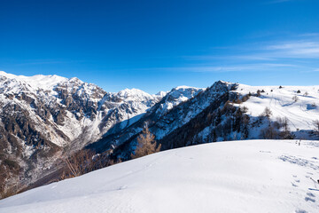 Mountain range of the Monte Carega in winter with snow, also called the Small Dolomites (Piccole Dolomiti) and the Altopiano della Lessinia (Lessinia Plateau). Veneto and Trentino Alto Adige, Italy.