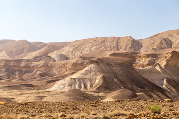 Rocky and dusty mountains in the Judaean Desert Midbar Yehuda Nature Reserve. Small Crater to Highway #90 and Golan Trail. Stunning landscape near the Dead Sea and Negev Desert in Israel.