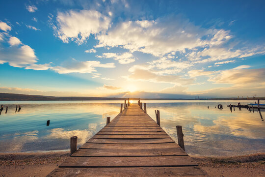Old wooden dock at the lake, sunset shot