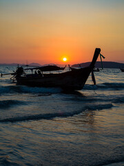 Traditional long-tail boat on the beach in Thailand - 419362470