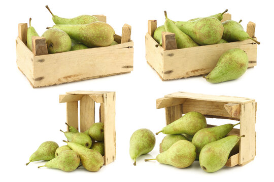 fresh juicy conference pears in a wooden box on a white background