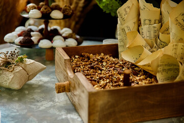 Wedding candy, nuts bar, table in rustic style, decorations made of wood