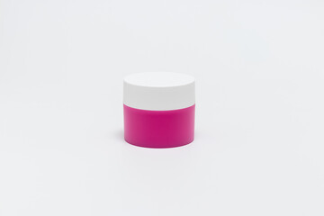 Pink white jar for cosmetic cream. Isolated jar for Beauty industry on white background.