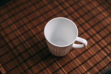 white mug on the table indoors stand texture top view