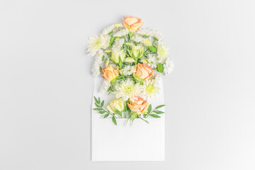 Creative layout composition of flowers on pastel background.