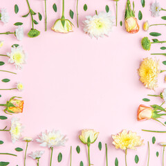 Creative layout composition of flowers on pastel background.