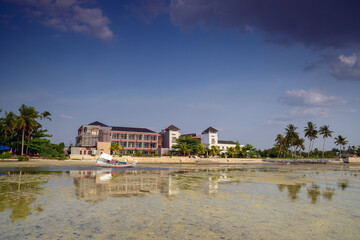 Boat on the beach in the hotel background