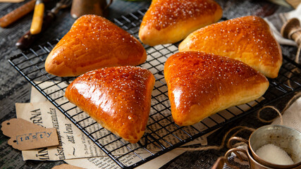 delicious homemade lemon shortbread crinkle cookies with powdered sugar, lemon slices on wooden board