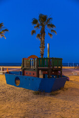 Naklejka premium playground for kids at sunrise with beautiful colors at malvarosa beach of the City of valencia, costa blanca, spain