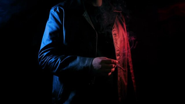 Man Smokes In Neon Red And Blue Glow