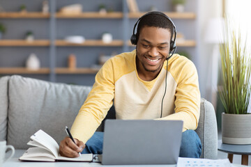 Positive black guy attending online training from home