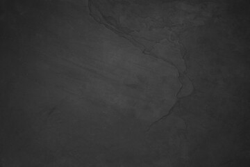 Black slate surface as background, top view