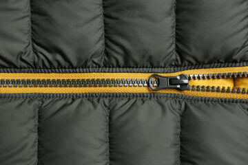 Jacket with zipper as background, top view © New Africa