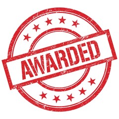 AWARDED text written on red vintage stamp.