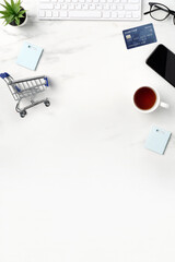 Top view of online shopping concept with credit card, smart phone and computer.