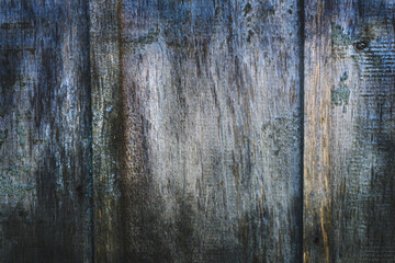 Fototapeta na wymiar Old, gray weathered boards. A fence of retro bars. Texture background. Сlose-up. Horizontal.