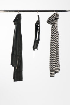 Elegant and trendy clothes for women hanging.