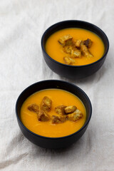 Pumpkin soup served with croutons