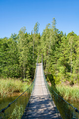 Obraz premium View of the suspension bridge between Sjalsundsnaset and Lango, Kopparo, Raseborg, Finland