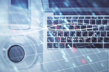 Stock market chart and top view computer on the table background. Multi exposure. Concept of financial analysis.