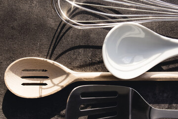 Top view of kitchen cutlery kit on gray background