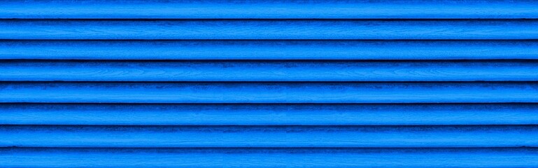 Panorama of Old blue wooden fence shutter lattice texture and background seamless