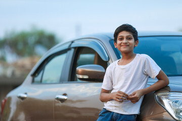 Cute Indian child with car