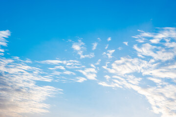Natural sunny blue sky background with beautiful puffy white cumulus clouds and fluffy cirrus clouds. Beautiful natural sky background, copy space