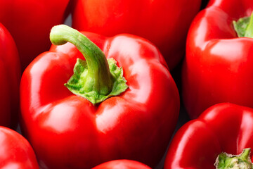 Red bell peppers background. Top view