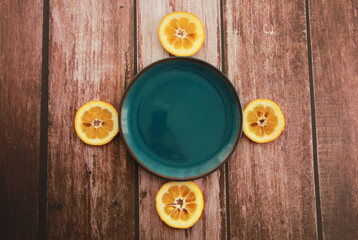 blue decorative plate and round orange slices