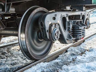A railway bogie on the rails. Close-up.