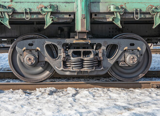 A railway bogie on the rails. Close-up.