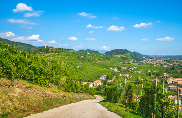 Prosecco Hills landscape, country road and vineyards. Unesco Site. Veneto, Italy