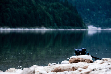 Camera left on a rock at the beach