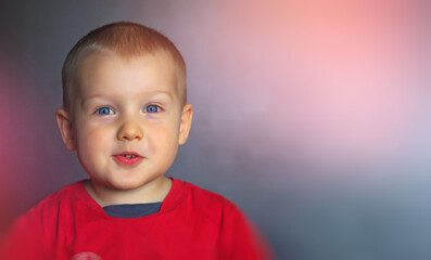 Little boy of 2.5 years happily surprised by the emotions of the child