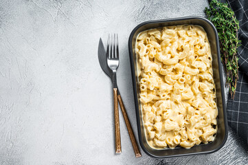 Mac and cheese american macaroni pasta with cheesy Cheddar sauce. White background. Top view. Copy...